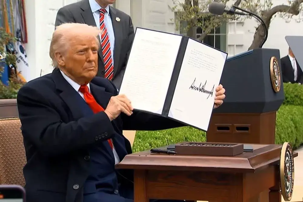 a man holding up a book